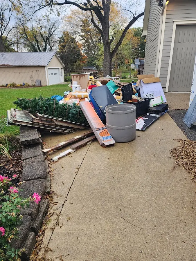 Dumpster being loaded with debris for Commercial Dumpster Rental in Milliken